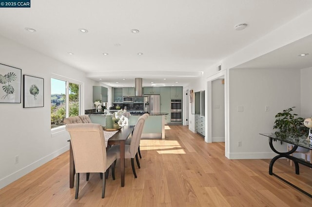 dining room with light wood-type flooring