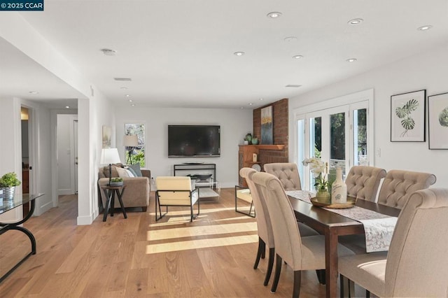 dining space with light hardwood / wood-style floors