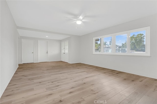 unfurnished bedroom featuring ceiling fan and light hardwood / wood-style flooring