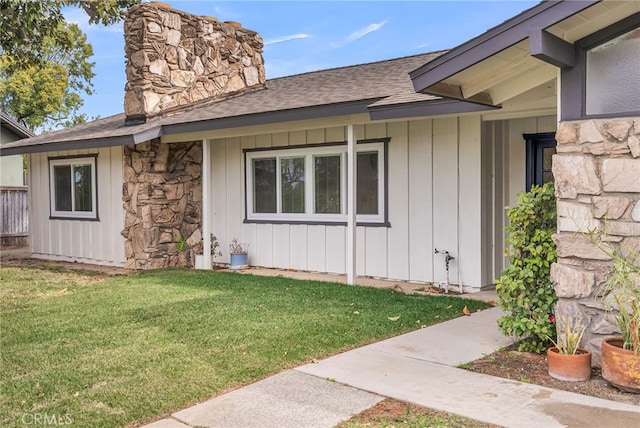 view of side of home featuring a yard