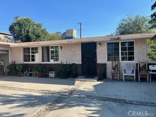 single story home with central AC unit