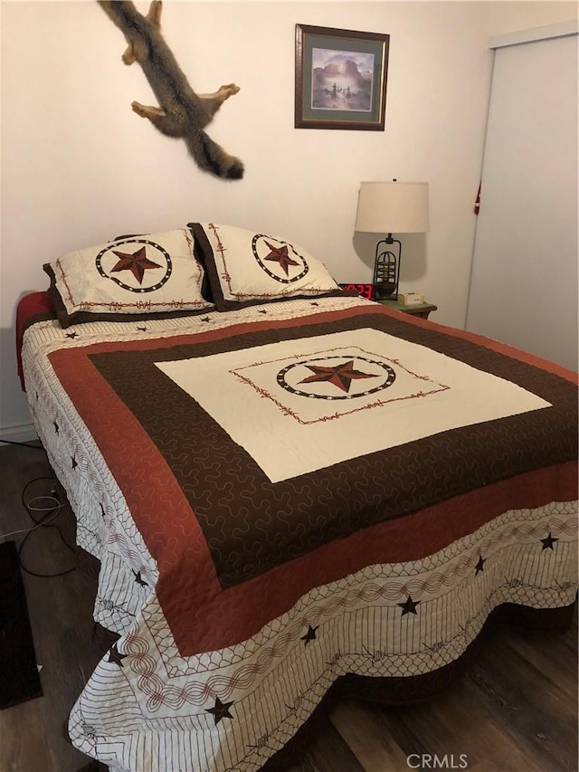 bedroom featuring wood-type flooring