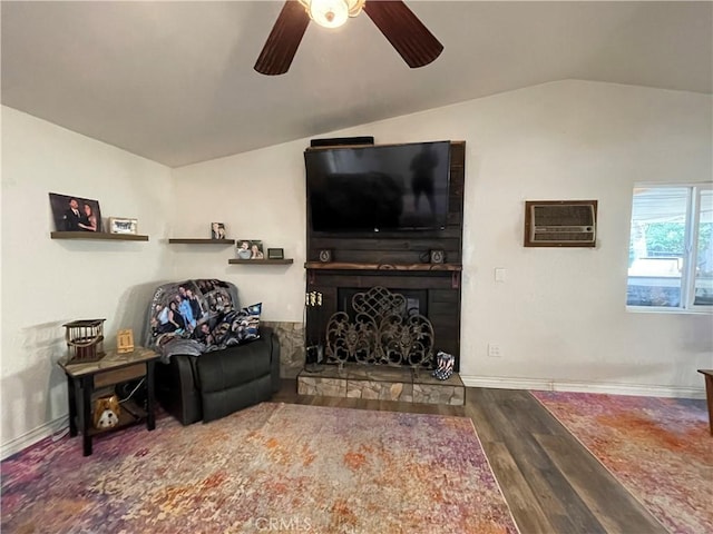 living room with lofted ceiling, hardwood / wood-style floors, an AC wall unit, and ceiling fan