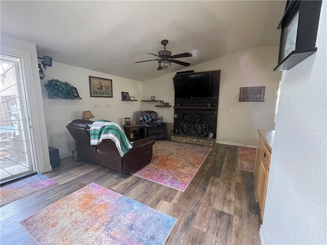 living room with vaulted ceiling, dark hardwood / wood-style floors, and ceiling fan