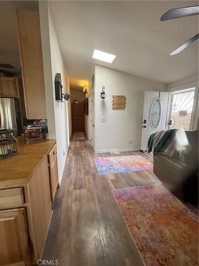 interior space featuring lofted ceiling and dark hardwood / wood-style floors