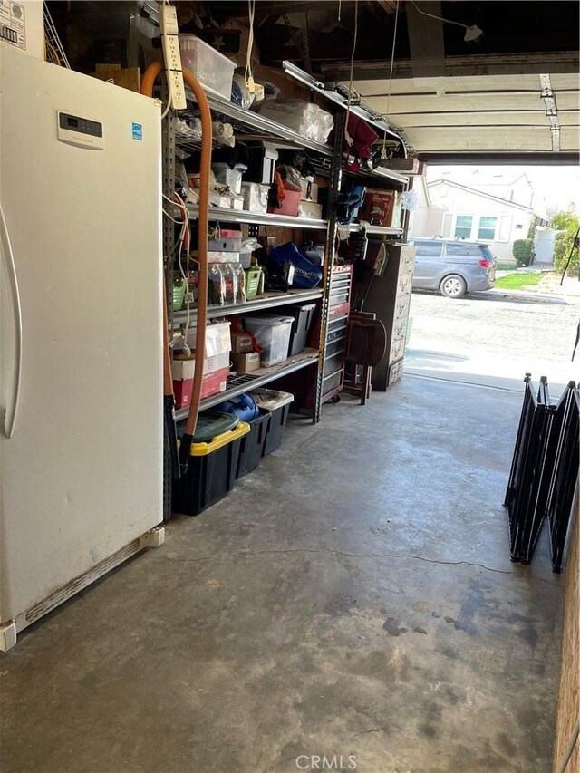 garage with white fridge