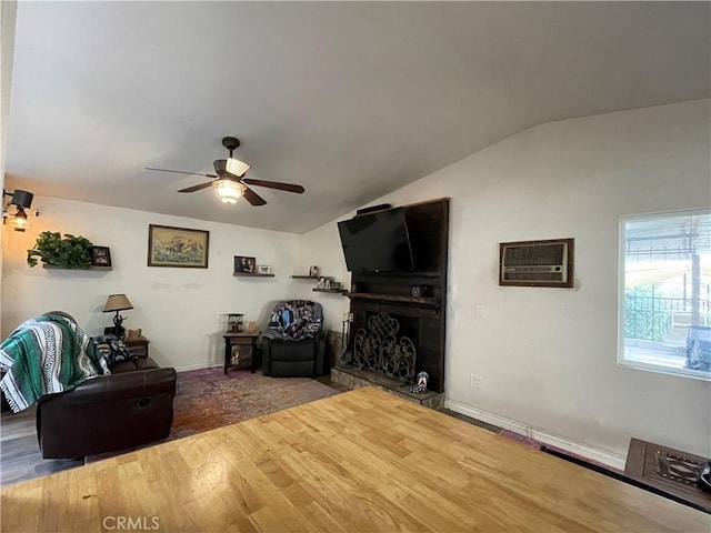 unfurnished living room with ceiling fan, lofted ceiling, hardwood / wood-style floors, and an AC wall unit