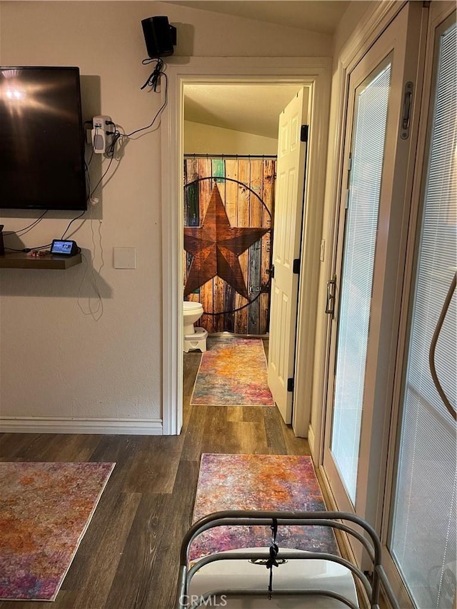 hallway with dark hardwood / wood-style floors