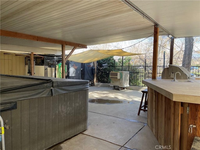 view of patio featuring an outdoor bar