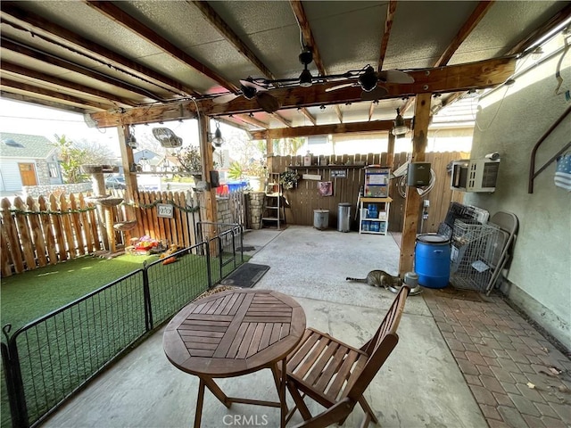 view of patio / terrace with ceiling fan and a wall mounted AC