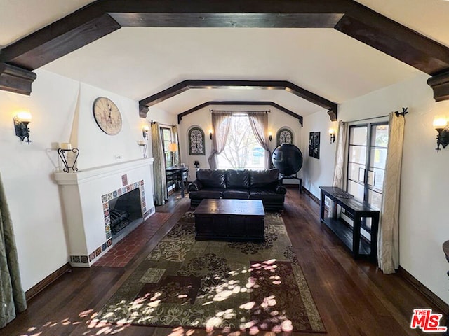 living room with a fireplace, lofted ceiling with beams, and dark hardwood / wood-style flooring