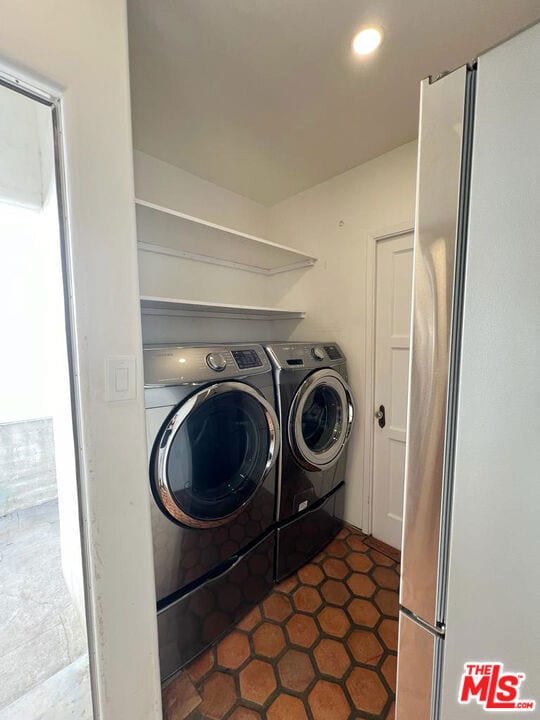 laundry room featuring separate washer and dryer