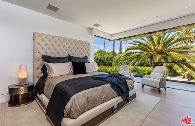 bedroom with light hardwood / wood-style flooring