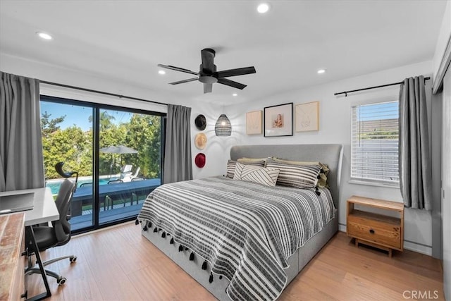 bedroom featuring access to exterior, light hardwood / wood-style flooring, and ceiling fan