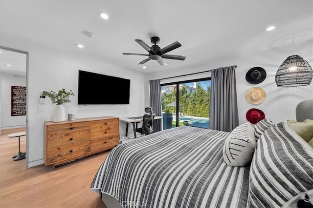 bedroom with wood-type flooring, ceiling fan, and access to outside