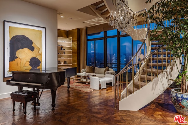 miscellaneous room featuring parquet flooring and an inviting chandelier