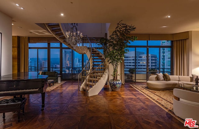 interior space featuring parquet flooring, expansive windows, and an inviting chandelier