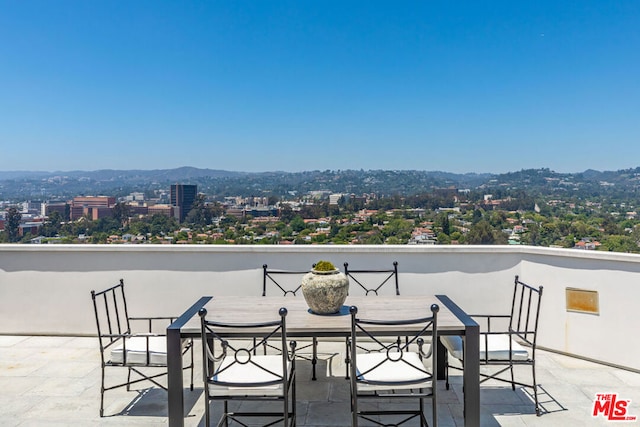 view of patio / terrace with a mountain view