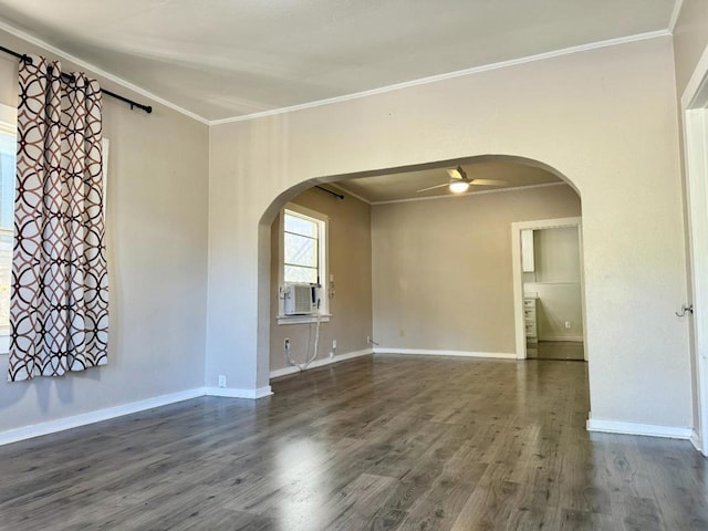 empty room featuring crown molding, dark wood-type flooring, and cooling unit