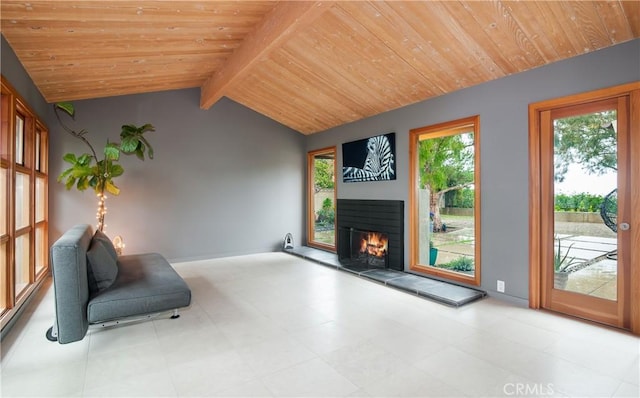 unfurnished room with wood ceiling, a fireplace, and lofted ceiling with beams