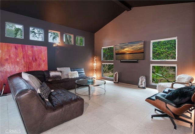 living room featuring high vaulted ceiling and beamed ceiling