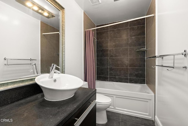 full bathroom featuring toilet, vanity, shower / bath combo, and tile patterned flooring