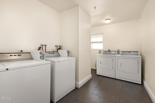 laundry area with independent washer and dryer