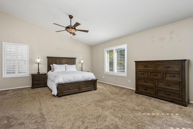 carpeted bedroom featuring lofted ceiling and ceiling fan