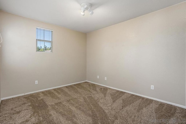 unfurnished room with carpet flooring