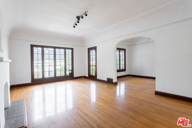 unfurnished living room featuring light wood-type flooring