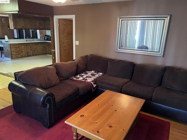 living room with sink and a textured ceiling