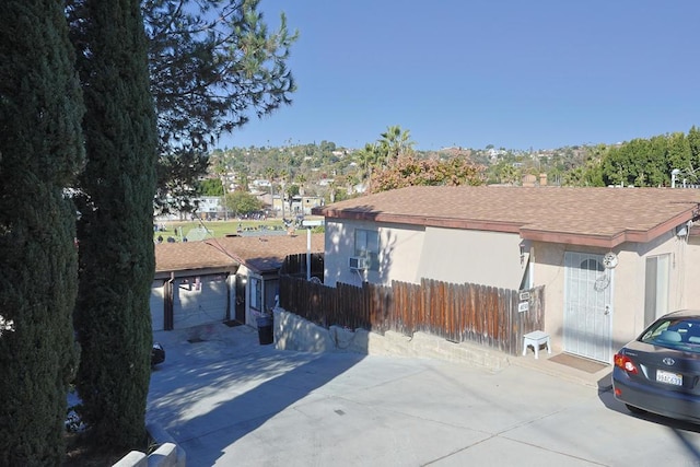 view of side of home with a garage