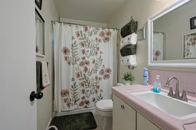 full bathroom featuring shower / tub combo, tile patterned floors, tasteful backsplash, toilet, and vanity