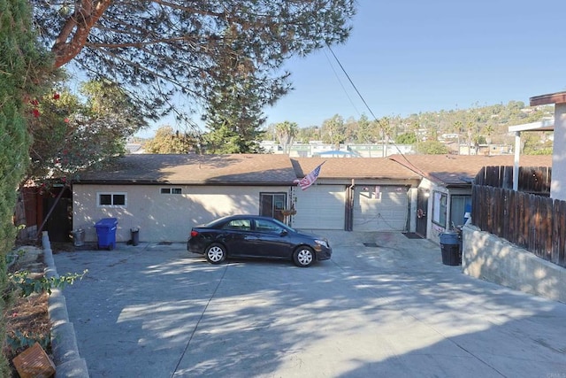 ranch-style home featuring a garage