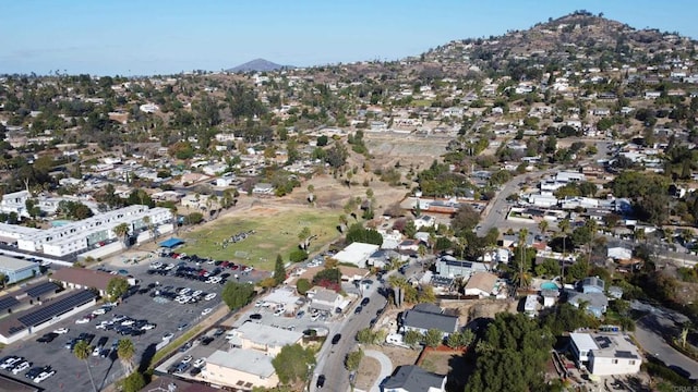 birds eye view of property featuring a mountain view