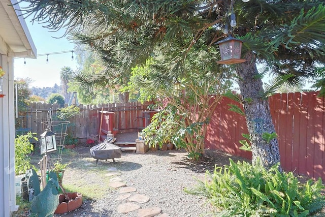 view of yard with an outdoor fire pit