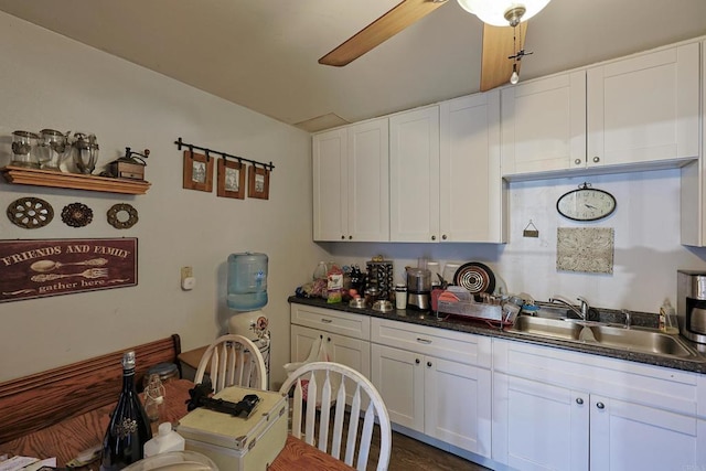 kitchen featuring sink and white cabinetry