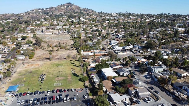 birds eye view of property featuring a mountain view