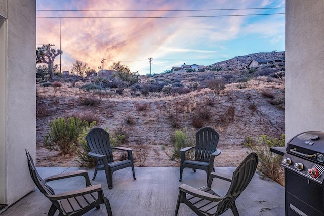 patio terrace at dusk with area for grilling