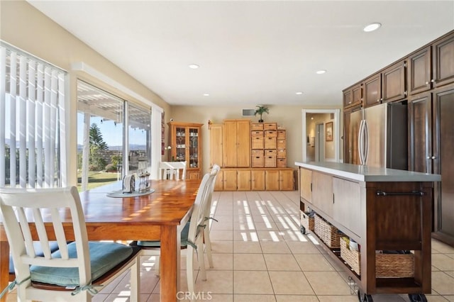 dining area with light tile patterned flooring