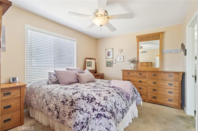 carpeted bedroom featuring ceiling fan