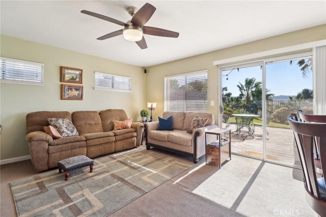 living room with carpet floors and ceiling fan