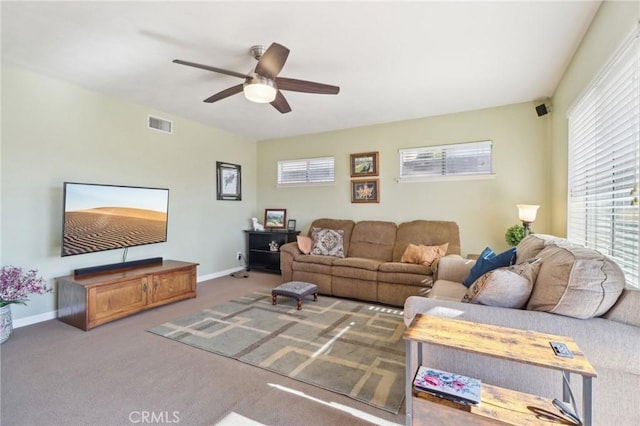 living room featuring carpet flooring and ceiling fan