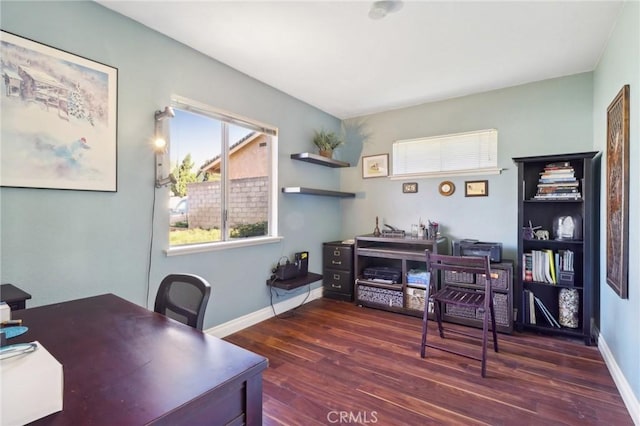 office with dark hardwood / wood-style flooring