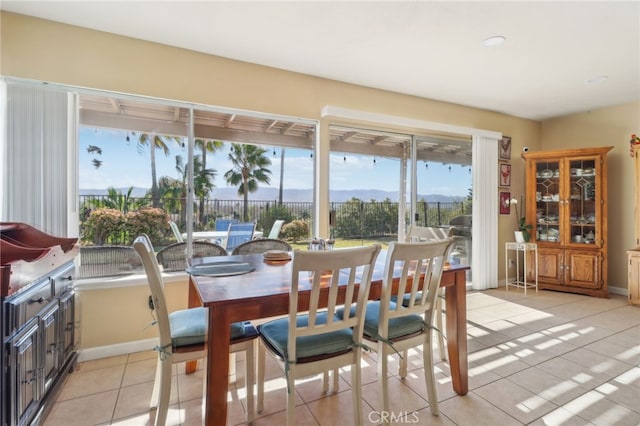 tiled dining space with a mountain view