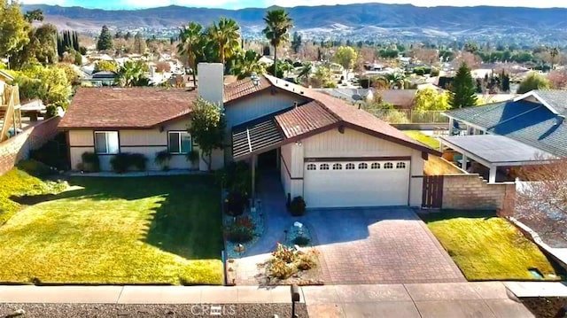 drone / aerial view featuring a mountain view