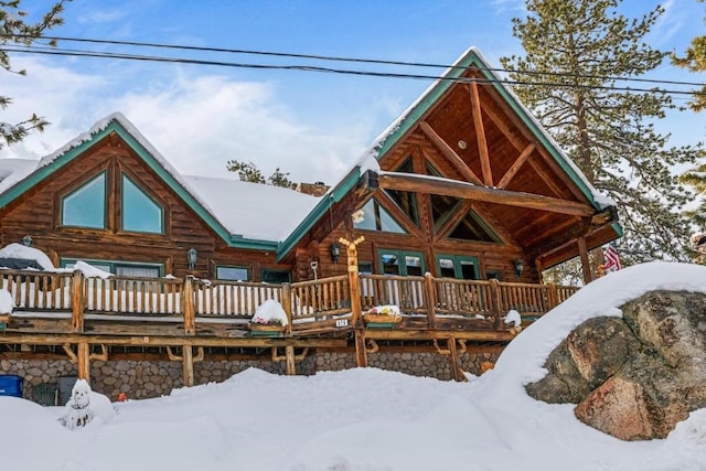 view of front of house featuring log exterior