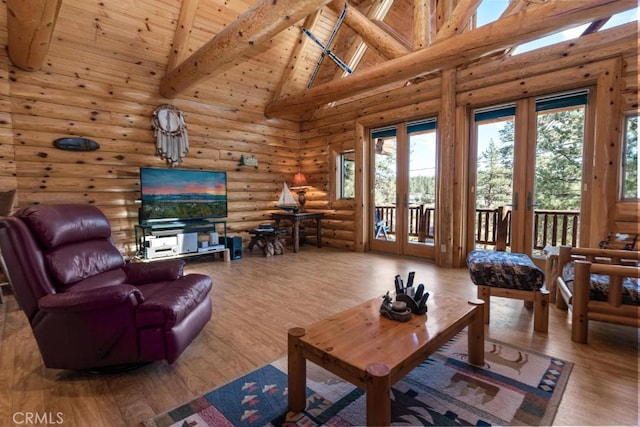 living room featuring wood ceiling, hardwood / wood-style floors, high vaulted ceiling, beamed ceiling, and rustic walls