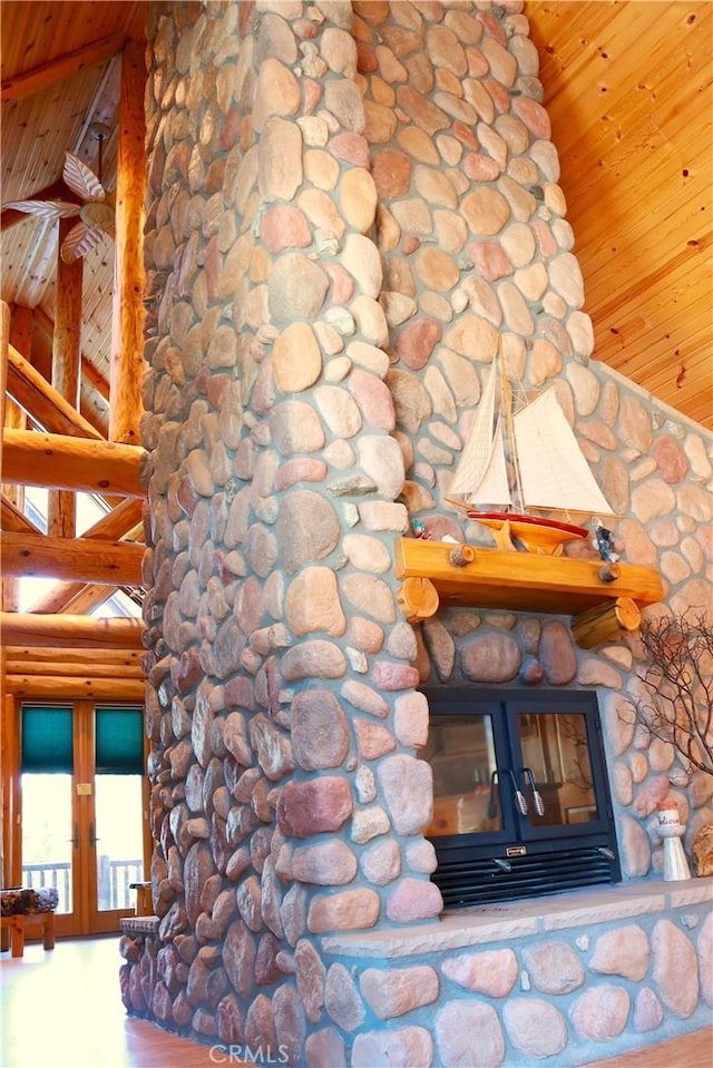 details featuring wooden ceiling and log walls