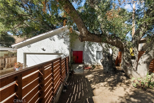 view of side of property featuring a garage